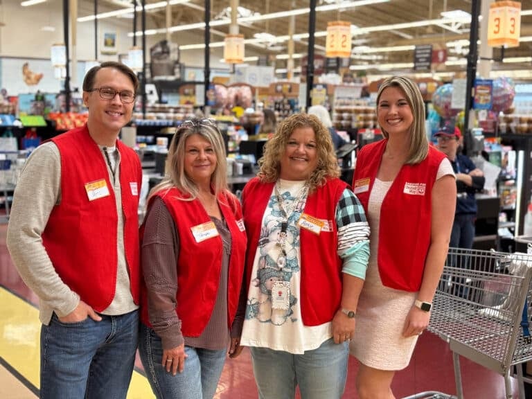 A group of volunteers in a Food City grocery store.